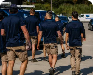 Plumbers walking to their service vans on a Hornsby job